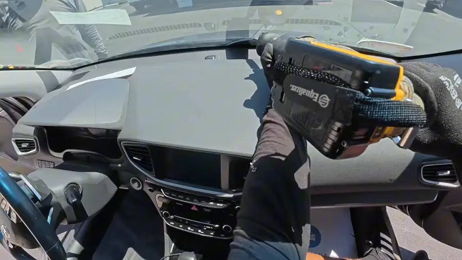 driver reviewing an inspection sticker